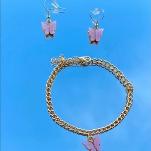 1 pink butterfly earring with a matching bracelet